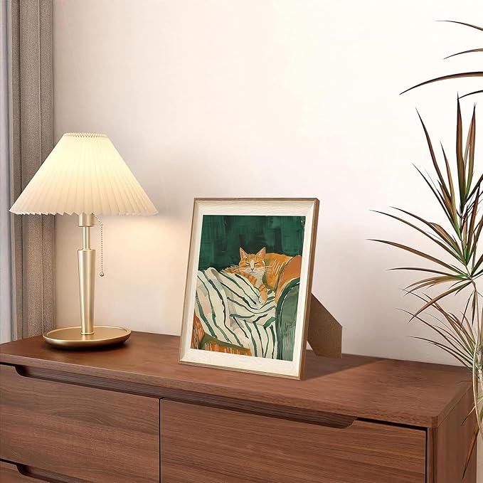 ASTRDECOR Minimalist Framed Wall Art - Cozy Cat Sleeping on Couch with Vintage Green & White Striped Blanket, Trendy Cute Orange Cat Canvas Posters, Modern Aesthetic Bedroom Apartment or Living Room Décor 10x12Inch