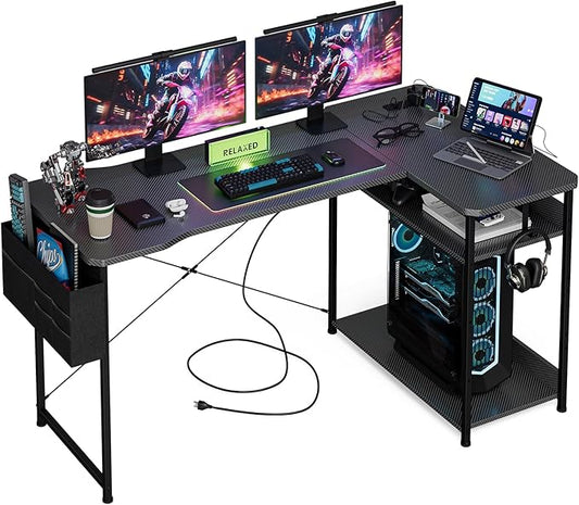 L Shaped Gaming Desk 55 Inch - Computer Corner Desk with Power Outlets, Reversible Shelves & Storage Bag for Home Office, PC Gaming Table, Black Carbon