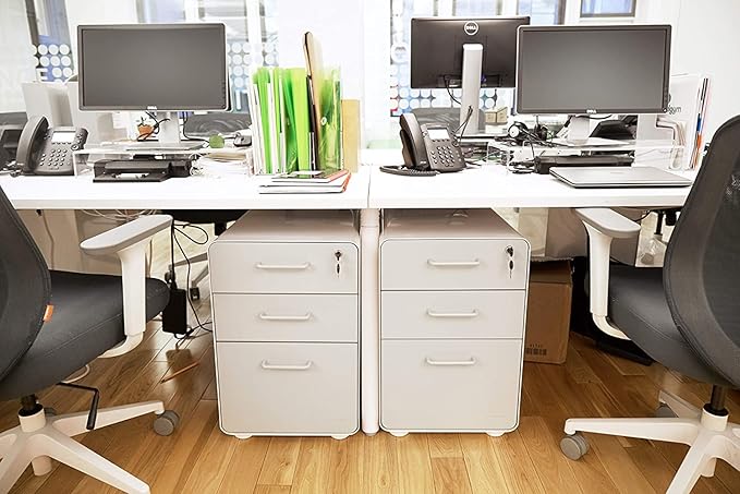 Poppin Stow 3-Drawer Rolling File Cabinet - White and Light Gray. Utility and Hanging File Drawers. Locking and Non-Locking Wheels. Powder-Coated Steel. Two Keys Included